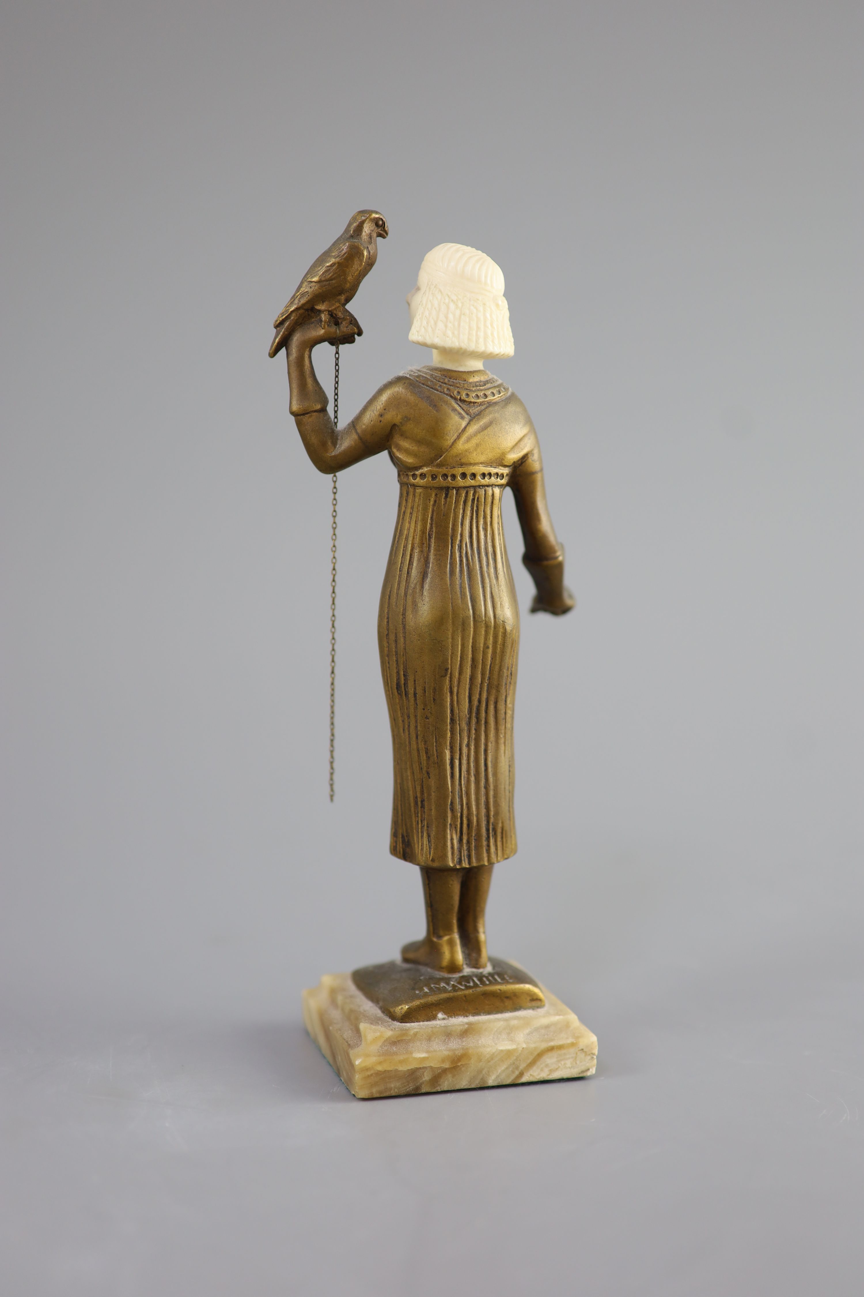 Hélène Maynard White (American, b.1870). A bronze and ivory figure of an Egyptianesque girl, holding a falcon, c1920, 20cm high